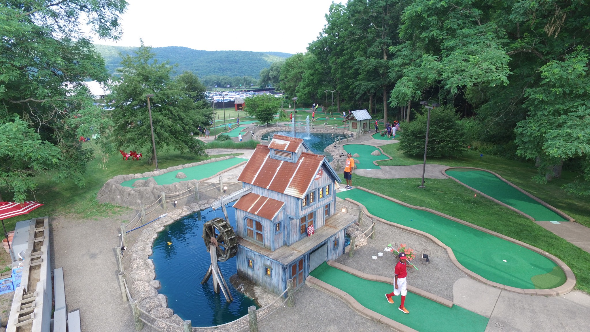 drone shot of Barnyard Swing mini golf course with water features