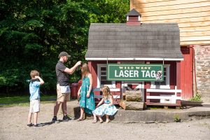 Family getting ready for laser tag at Barnyard Swing in Cooperstown, NY